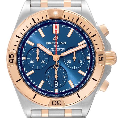 The Breitling Chronomat UB0134101C1U1 Men's Steel and Gold (two tone) Blue Dial watch is shown from a front angle, highlighting the blue dial, rose gold bezel, and chronograph sub-dials.