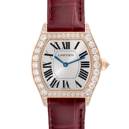 This image shows a straight-on view of a Cartier Tortue WA507031 Women's Rose Gold Silver Dial WA507031 Women's Rose Gold Silver Dial watch with a diamond-encrusted bezel and a red leather strap.