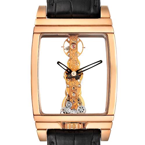 The image shows a Corum Golden Bridge B113/01043 - 113.160.55/0002 0000 Men's Rose Gold Transparent Dial B113/01043 - 113.160.55/0002 0000 Men's Rose Gold Transparent Dial watch front-facing, highlighting its intricate movement and rectangular gold case.