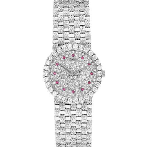 The Piaget 9190D23 Women's White Gold Silver Dial 9190D23 Women's White Gold Silver Dial Tradition White Gold Diamond Ruby Ladies Watch 9190D23 is shown from a top view, displaying its diamond and ruby-set face and bracelet.