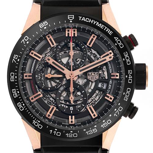 The Tag Heuer Carrera model CAR205A.FT6087 is shown from the front, highlighting its skeleton dial, tachymeter, and chronograph subdials.