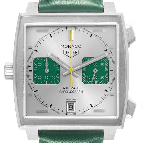 The image shows a front view of the Tag Heuer Monaco CAW218E.FC6565 Men's Titanium Silver Dial watch, highlighting its square case, subdials, and green strap.