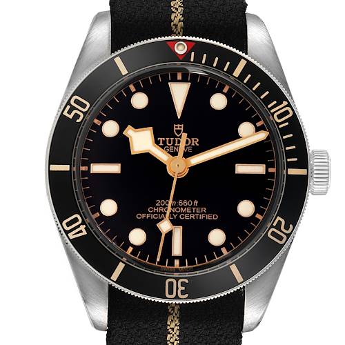 The Tudor Heritage Black Bay 79030N Men's Stainless Steel Black Dial watch is shown from a front angle, highlighting the dial, bezel, and fabric strap.