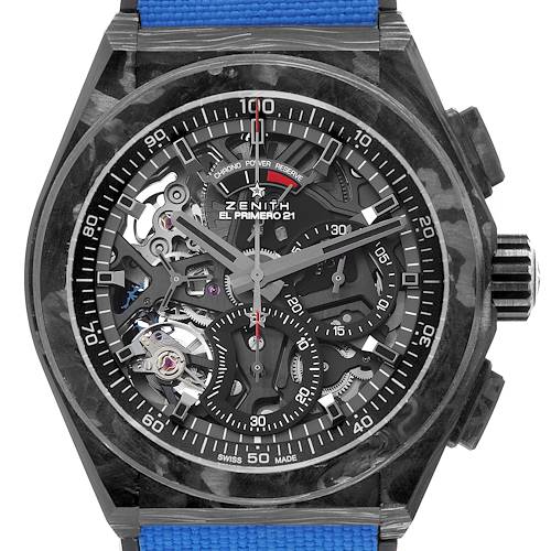The image shows a Zenith Defy 10.9000.9004 Men's Titanium Blue Dial El Primero 21 watch from a frontal angle, highlighting the dial and skeleton mechanics.